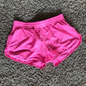 Bright pink under armour shorts.